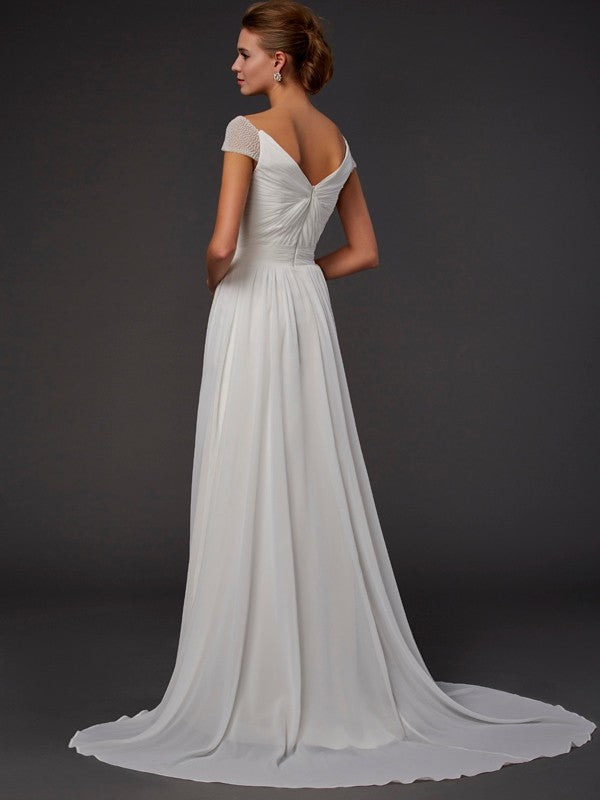 Vestidos largos de gasa con escote corazón, corte princesa, mangas cortas y abalorios